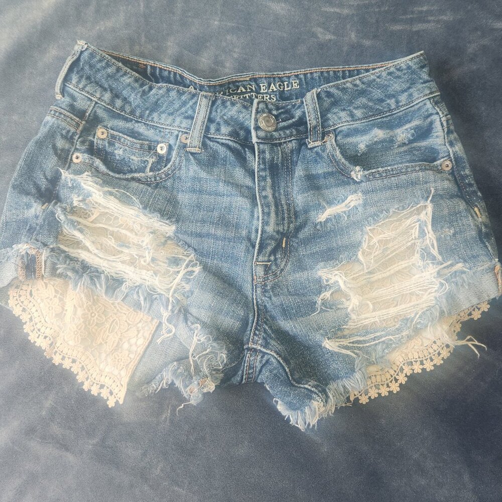 American Eagle Outfitters Ladie's stylish distressed w/ lace shorts, 26" waist